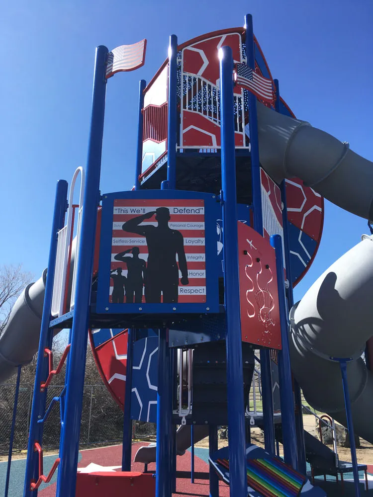 Veteran's graphic and flag elements at playground. Veteran's Park